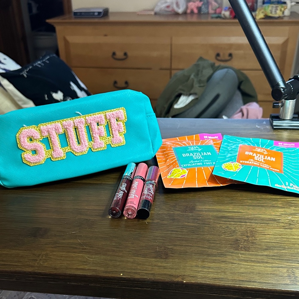 Teal Cosmetic Bag with Lip Gloss and Skincare